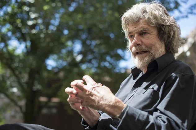 Mountaineer, museum founder and author Reinhold Messner gestures in conversation.