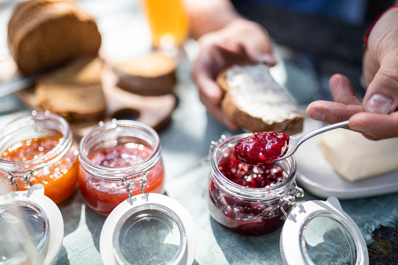 A person takes a spoonful of South Tyrolean jam