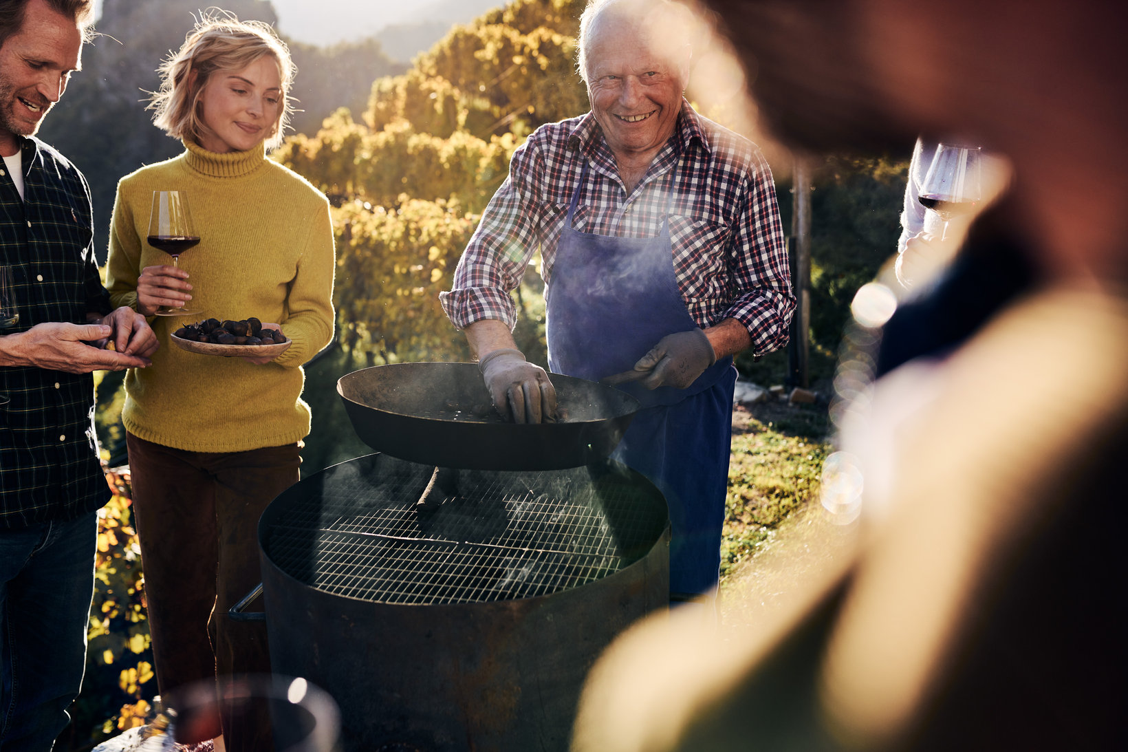 Several people roasting chestnuts