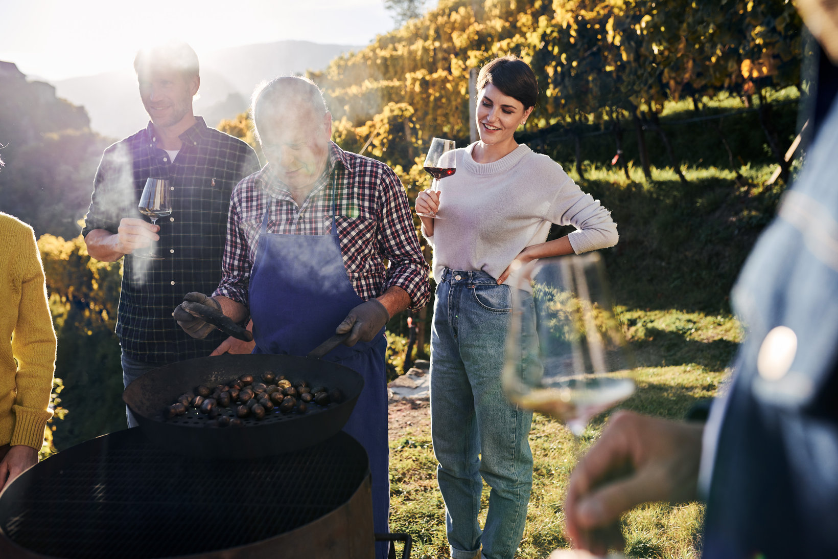 A farmer roasts chestnuts during Törggelen in the Isarco Valley